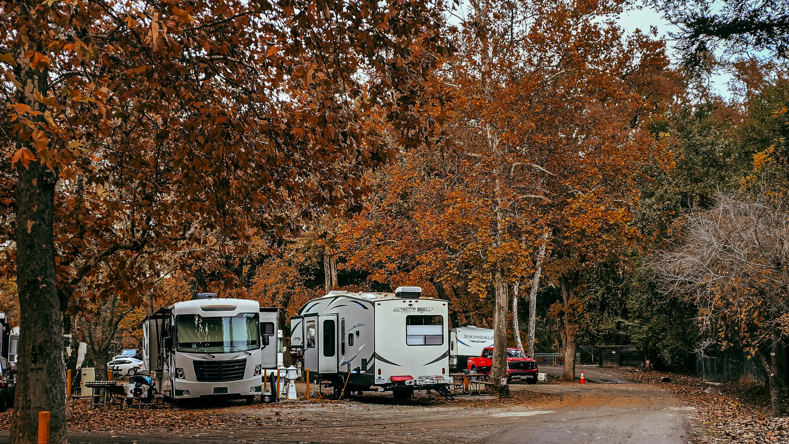 RV parked in a scenic forest campground ready for camping season